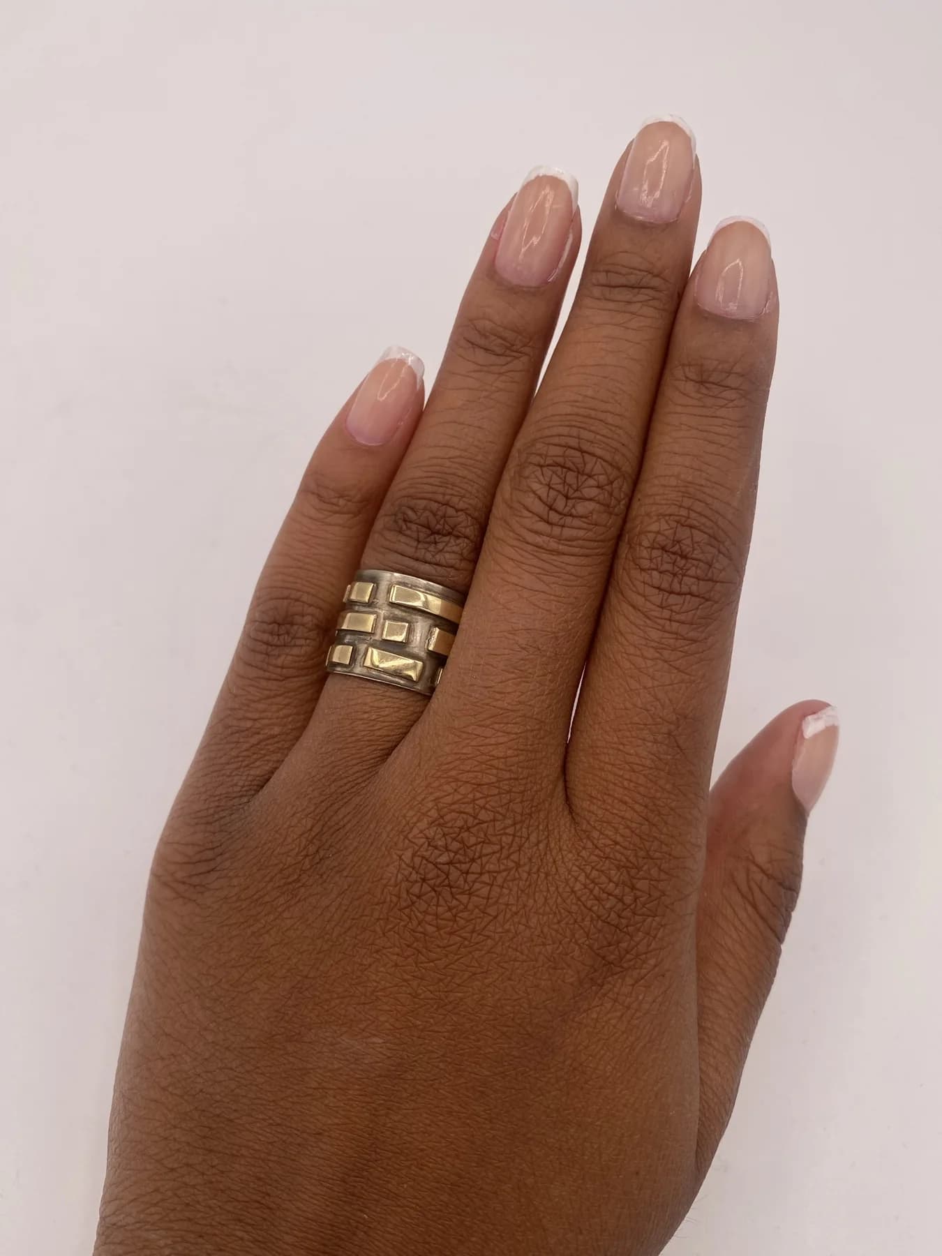 Stacked rings shown on the hand from above.